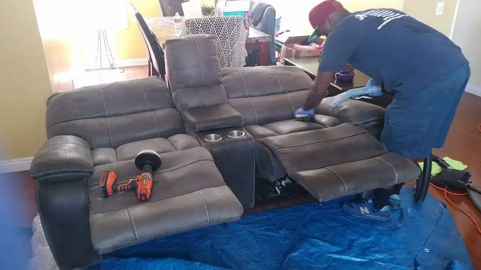 Sectional sofa being cleaned in a living room